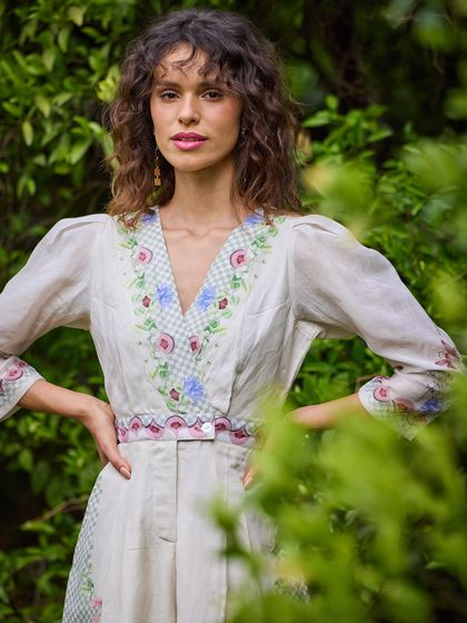 Styling and direction for the sustainable brand Pozruh. This look features a hand-embroidered jumpsuit, shot in a natural, green setting to align with the brand's ethos.