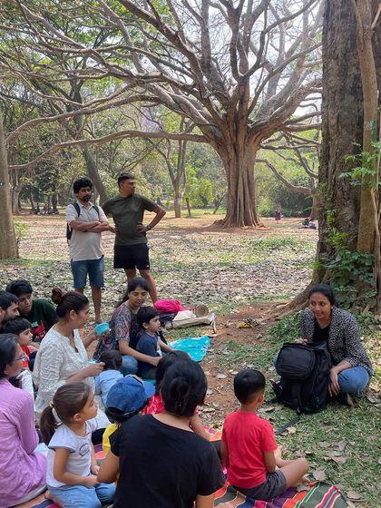 A guest storyteller captivates the audience during our Holi celebration. We often invite friends to share their tales, bringing diverse voices and styles to our children's literature sessions.