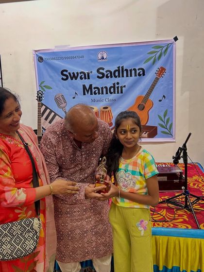 A proud moment as a young student receives a trophy for her performance. We believe in celebrating every milestone, and our annual event is filled with recognition and applause for our talented tribe.