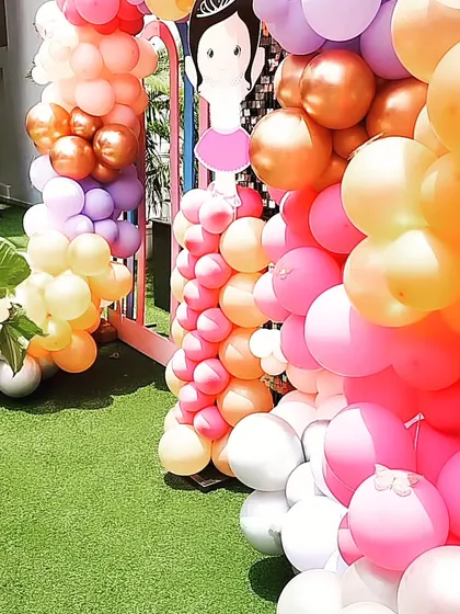 A cascade of colorful balloons creates a beautiful and festive backdrop for the Ballerina party.