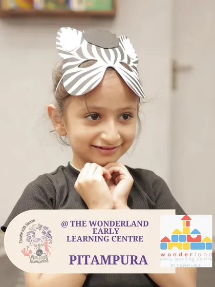 A young girl in a zebra mask, fully in character during our "Yarntellers" program at The Wonderland Early Learning Centre.