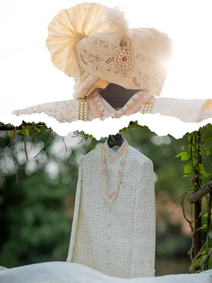 An artistic shot of the groom's sherwani and turban, highlighting the details of the wedding attire.