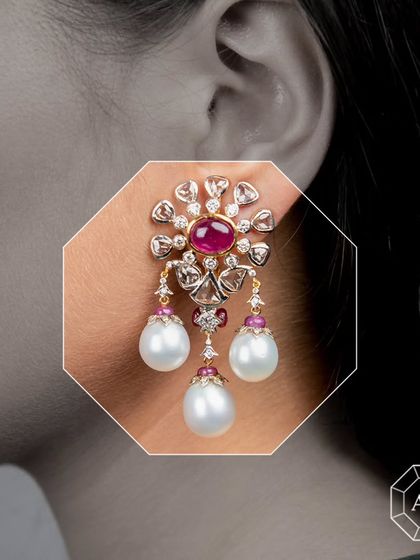Our exquisite statement earrings feature mesmerizing rubies surrounded by rose-cut and round diamonds set in a delicate pavé, enhanced with lustrous South Sea pearls.