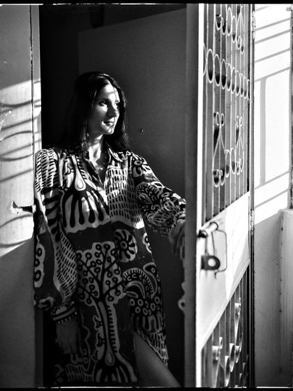 Aanchal, bathed in the sharp light of the afternoon sun. The shadows create a beautiful pattern, making this a striking and dramatic portrait.