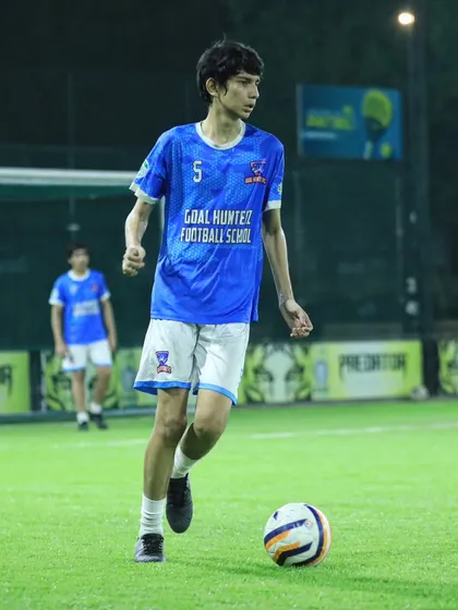 One of our young academy players focused on the ball during a training session.