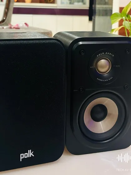 The Polk ES10 speaker with its anti-diffraction magnetic grille. This speaker is Hi-Res Audio Certified and compatible with Dolby Atmos and DTS:X, offering great sound for everyone.