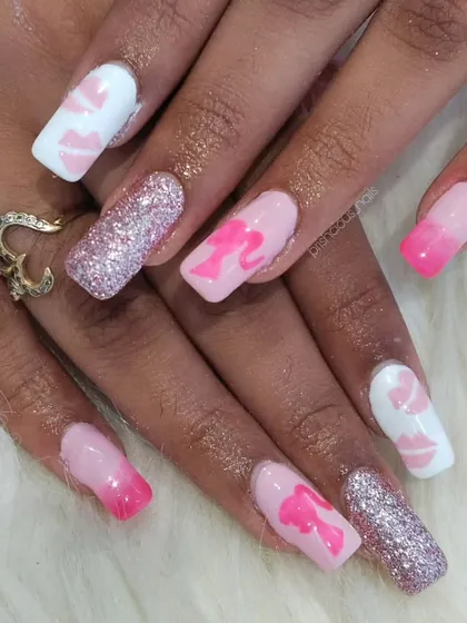 Hy Barbie! Another take on the Barbie trend, this time on long, square extensions with glitter, hearts, and the iconic silhouette.