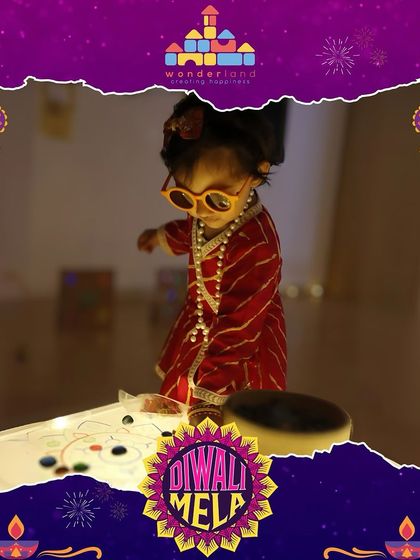 A toddler dressed in festive attire explores a light table during our Diwali Mela. We celebrate the festival of lights with safe, sensory-rich activities that everyone can enjoy.