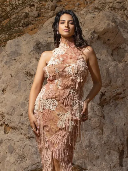 A duplicate of image 7, this shot captures the model in a textured gown against a rocky desert backdrop, showcasing my work in on-location fashion editorials.
