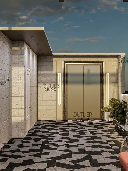 This view of the party terrace shows the lift entrance and a spiral staircase, with a dramatic water feature and bold geometric flooring that makes a strong design statement.
