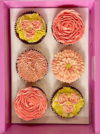 A box of our buttercream floral cupcakes created especially for Mother's Day. This set features a variety of pink-toned flower designs, from multi-layered roses to delicate buds, showing how we can create a cohesive and elegant theme for your gift.