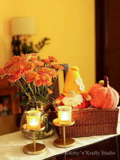 Another view of my autumn tablescape, glowing in the warm candlelight. The handmade crochet pieces add a soft and cozy texture to the seasonal decor.