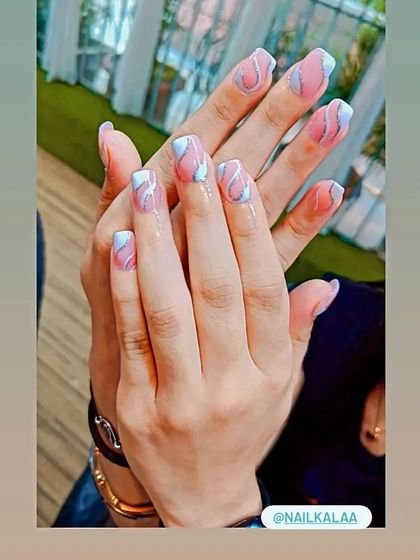 A pretty pastel design with a soft pink and blue base, accented with wavy silver glitter lines.