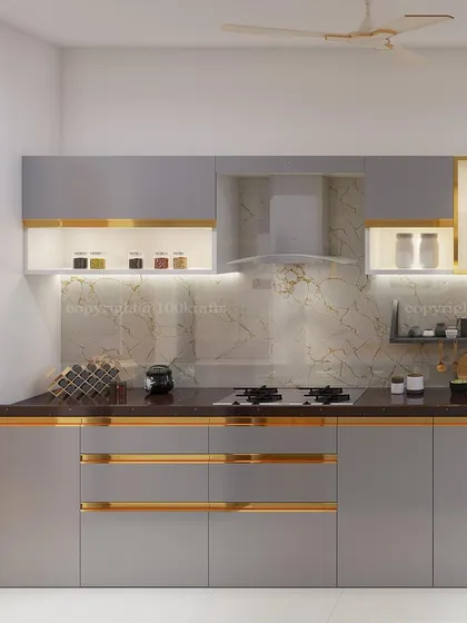 The kitchen is the heart of the home, where stories simmer. This modern kitchen design balances warm greys and clean lines with a hint of gold, creating a space that is sleek, functional, and built to feel like the warm center of your home.
