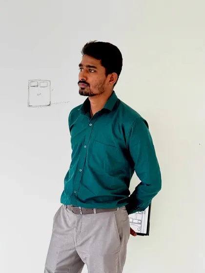 Taking a moment on-site. The small sketch on the wall behind me is a rough plan for the bed placement, a starting point for the entire room's design.