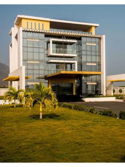 The Admin Block at Krishna Sai Granites stands as a testament to our belief that industrial architecture can be dramatic. The facade features extensive use of engineered glass, a 32-foot cable-stayed entrance porch, and accents of Aluminum Composite Panels (ACP).