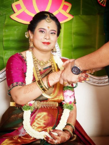 A close-up of the mom-to-be's makeup. The look is traditional and celebratory, perfect for her South Indian baby shower ceremony.