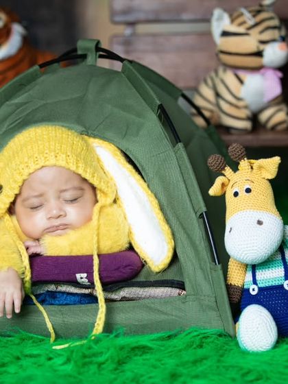 This little camper is joined by a friendly giraffe, making for a cute and imaginative scene.