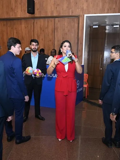 Leading an ice-breaker activity with participants to build energy at the start of the L&T event.