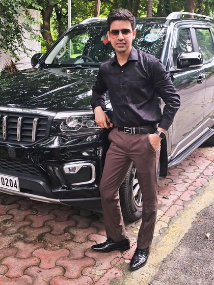 Standing by my car, a symbol of the dreams I am building. This journey is about turning ambition into reality through hard work.