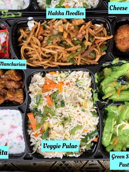 An Indo Chinese fusion meal tray for a change of pace. This box contains Green Sauce Pasta, Veg Hakka Noodles, Veggie Pulao, Babycorn Manchurian, a cheese ball, and raita.