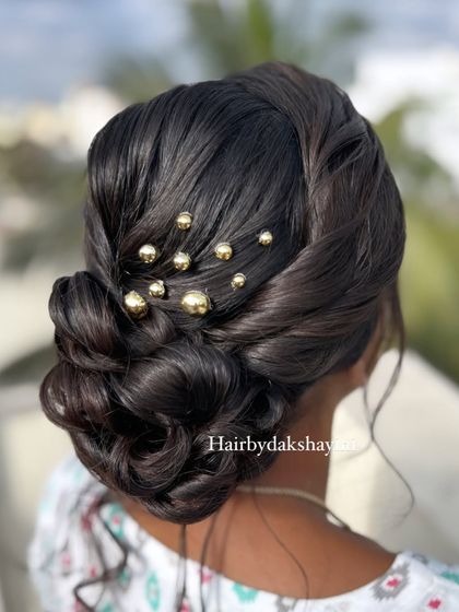 A side view of the textured low bun, showing its elegant shape.