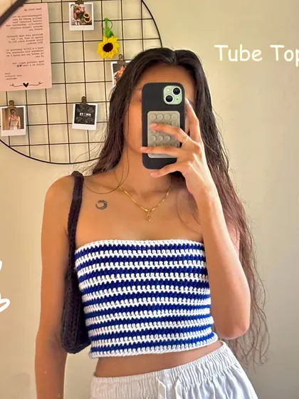 A classic blue and white striped crochet tube top. It's a simple, versatile piece that you can pair with almost anything.