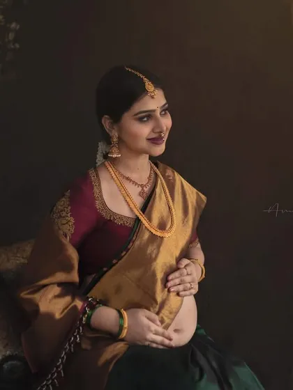 The color version of the same portrait, showcasing the rich tones of the saree and the warm, painterly background. This was created for a client from North Karnataka, with a backdrop inspired by the region's stone temples.