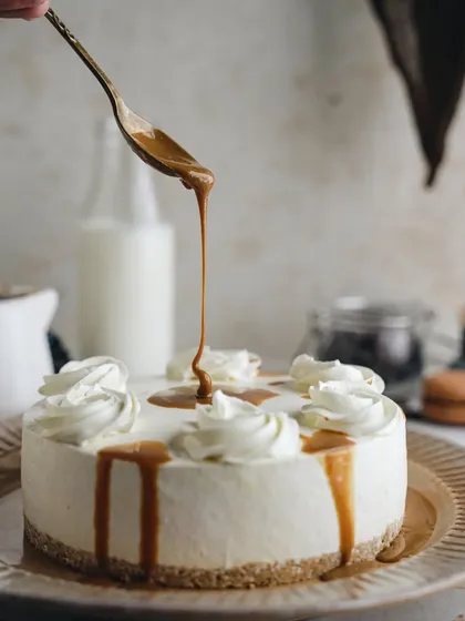 A beautiful caramel cheesecake, shot for a dessert company. The monochromatic beige tones and the dripping caramel create a sophisticated and elegant look.
