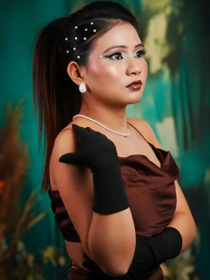 Another shot of the editorial look, showing the full styling with the satin dress and long black gloves.