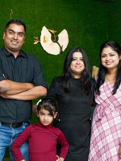 Another happy family celebrating at the pub. The green wall makes for a lovely, fresh photo background.