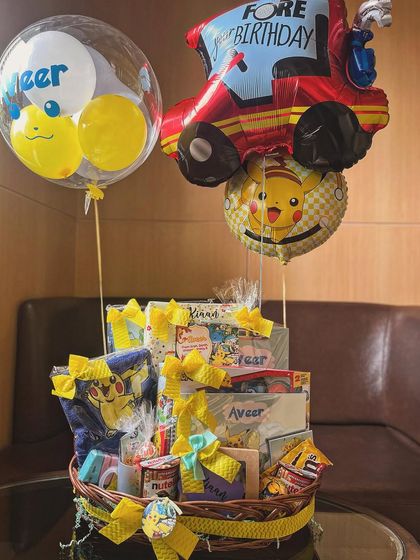 The hamper complete with Pokémon and monster truck balloons, creating a huge visual impact for the birthday celebration.