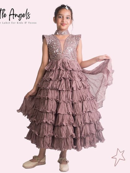 A beautiful mauve gown with a sequined top and a multi layered crinkle fabric skirt.