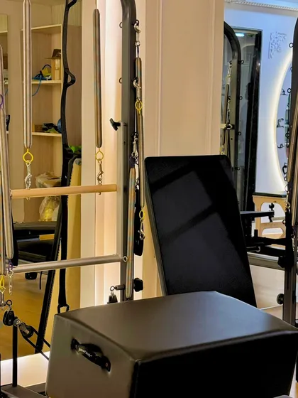 A look at the Cadillac and reformer setup in our GK-1 studio. This is where you'll build strength and grace.