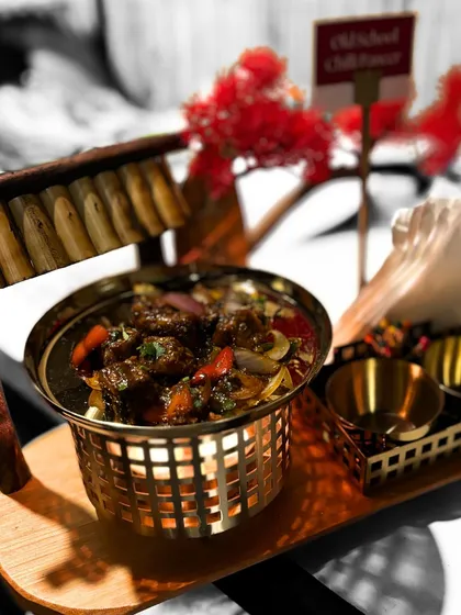 Our "Old School Chilli Paneer" is a timeless favorite, presented with a unique flair. Served in a basket over a candle warmer, we bring back the classic kick to spice up your events.