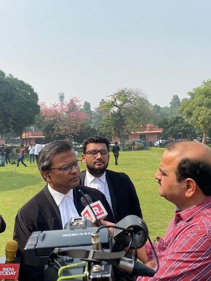 Briefing a group of journalists after a court session, ensuring the legal facts of the case are communicated accurately.