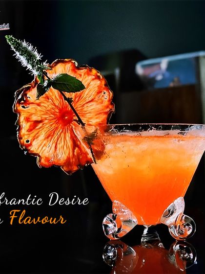 A frantic desire for flavor is what drives our creations. This unique cocktail, served in a wheeled glass and garnished with a dehydrated pineapple flower, is a testament to our innovative spirit.