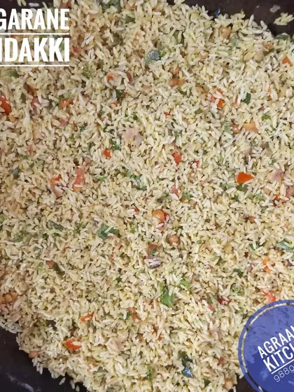 A large batch of Vaggarane Mandakki, or seasoned puffed rice, being prepared in my kitchen. This is a light and crunchy breakfast dish, popular in North Karnataka.