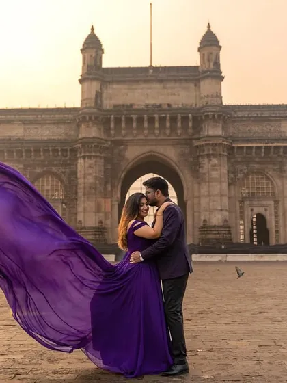 A magical moment captured at the Gateway of India. My purple flying gown with its magnificent trail adds a touch of royal elegance, perfect for creating iconic pre-wedding photos.