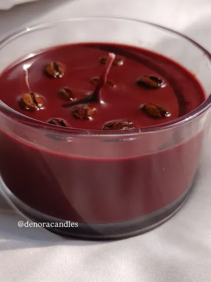 Another view of the dark roast coffee candle, showing its deep, inviting color.