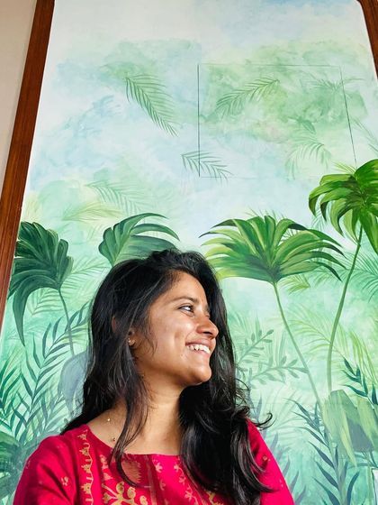 We call this our tropical paradise. We transformed the walls of a restaurant with a misty forest theme, covering even the doors to create a seamless, immersive jungle experience with colorful birds and lush greenery.