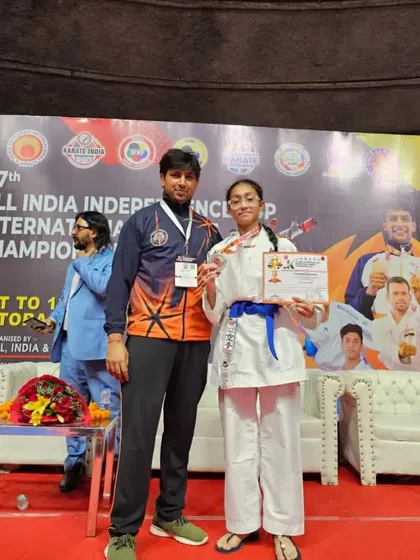 Standing with a silver medalist at the All India Independence Championship. Her focus and spirit were exceptional.