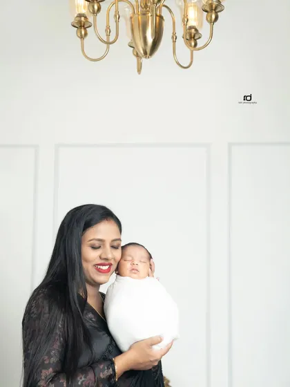 A mother's gentle embrace. There is nothing like the bond between a mother and her newborn, and I love capturing that peaceful, loving connection.