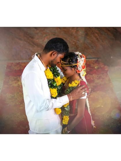 A quiet, heartfelt moment between the couple inside the temple. The soft, hazy light adds a dreamy and emotional quality to this traditional wedding photograph.