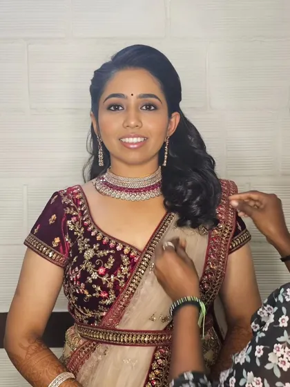 Getting the final touches just right for Varsha's reception. A happy bride ready for her celebration.
