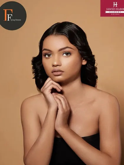 A beautiful portrait of a model with classic waves and clean makeup, done by our students for a portfolio shoot.