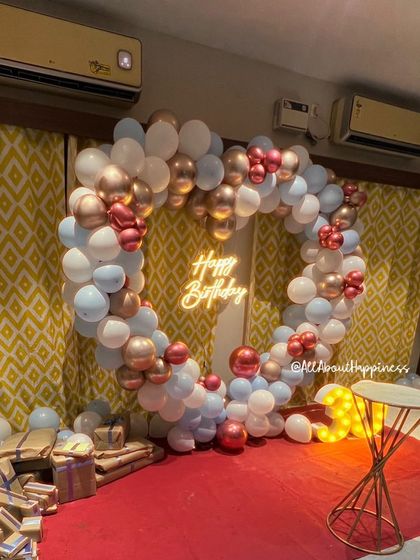 Another beautiful heart-shaped balloon backdrop, this time in a romantic palette of white, rose gold, and light blue.