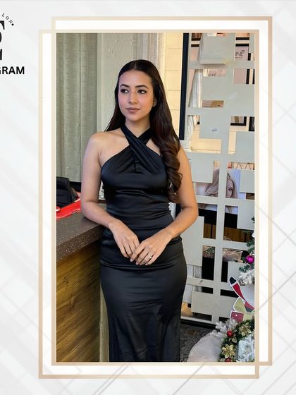 The complete look, showing how a simple black dress can be elevated with professional hair and makeup for a sophisticated and timeless style.