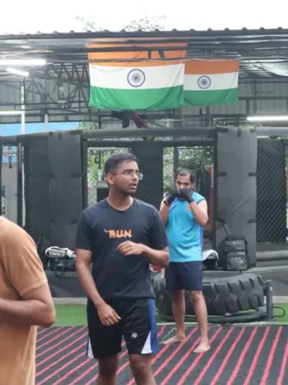 Students practice their boxing stance and movement. Footwork and head movement are just as important as throwing a punch.