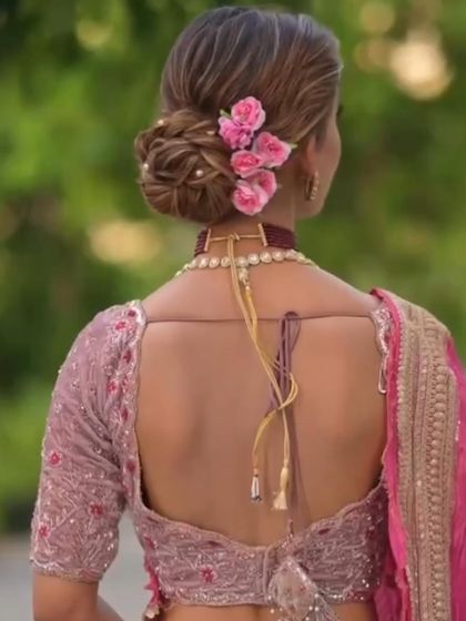 The back view of this romantic messy bun shows how I tucked in small pink roses and pearls to add dimension and a touch of color. It’s all in the details.
